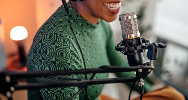 Woman-recording-her-voice-using-a-microphone